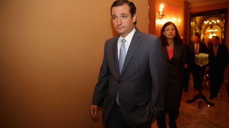 Sen. Ted Cruz leaves a Republican Senate caucus meeting at...