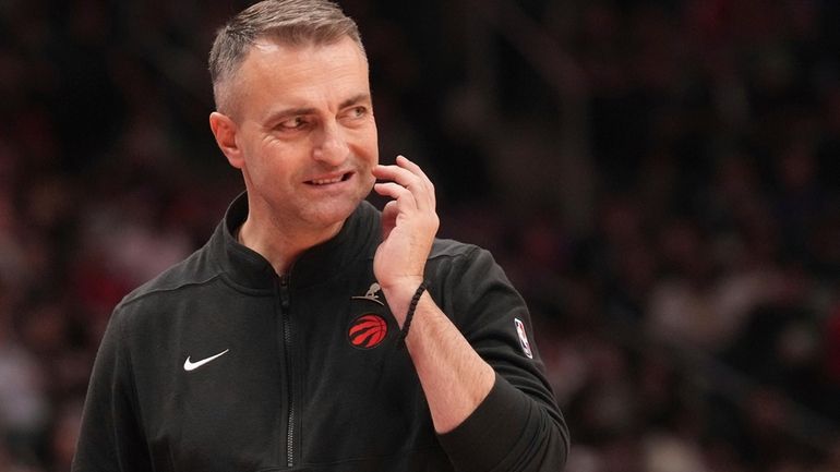 Toronto Raptors head coach Darko Rajakovic reacts during an NBA...