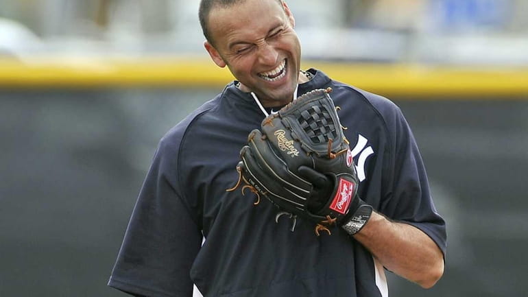 Derek Jeter enjoying a funny moment while working on his...