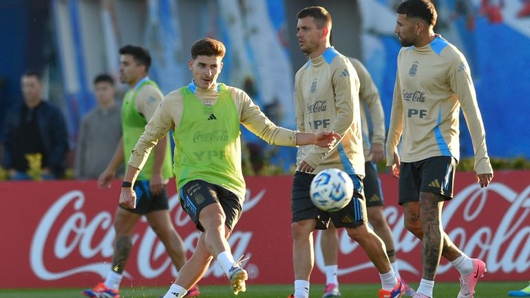 Argentina's Julián Alvarez kicks the ball during a training session...