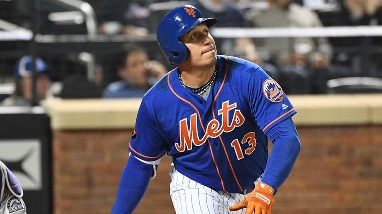 Asdrubal Cabrera watches his RBI triple against the Rockies at...