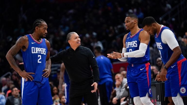 Los Angeles Clippers head coach Tyronn Lue, second from left,...