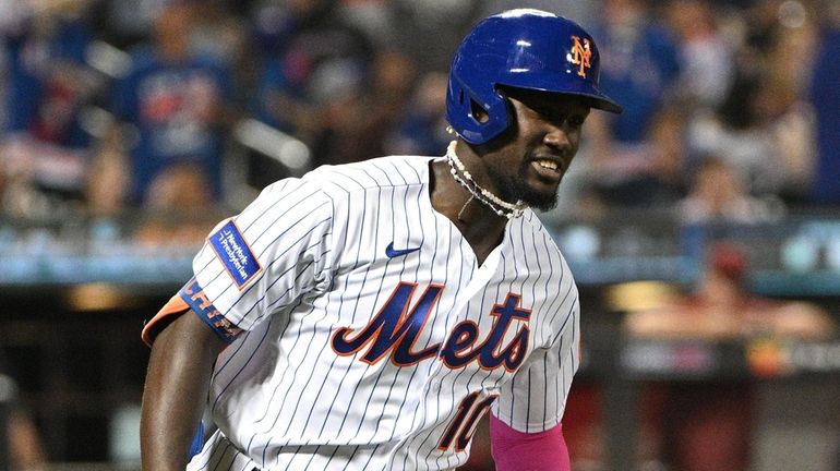 The Mets' Ronny Mauricio rounds the bases on his two-run...