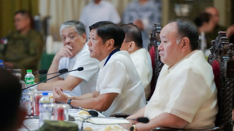 In this handout photo provided by the Malacanang Presidential Communications...