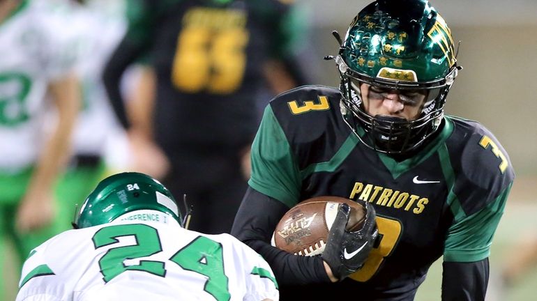 Ward Melville WR Lorenzo Velez takes the ball up the...