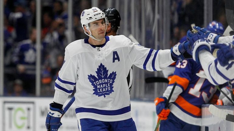 John Tavares #91 of the Toronto Maple Leafs celebrates his...