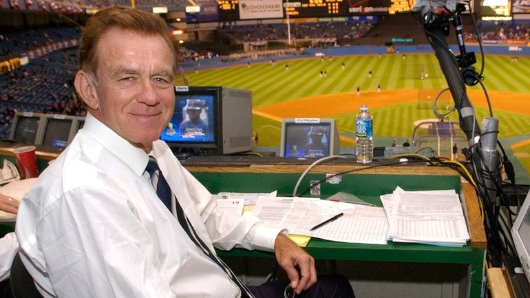 Baseball announcer Tim McCarver poses in the press box before...