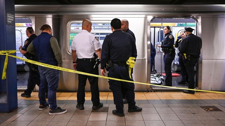 New York police officers and medics at the scene in...