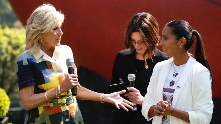 U.S. First Lady Jill Biden speaks next to Diana Flores,...