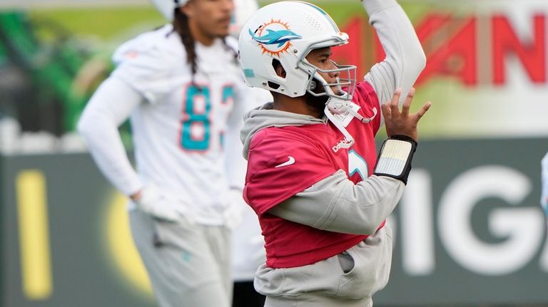 Miami Dolphins quarterback Tua Tagovailoa (1) throws the ball during...