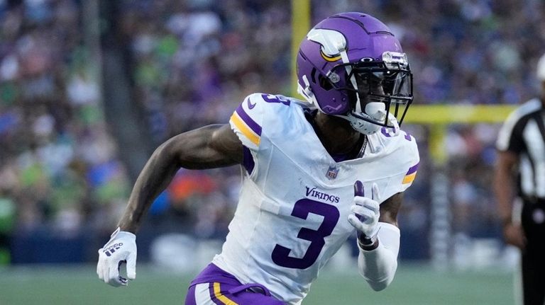 Vikings wide receiver Jordan Addison runs down the field during...