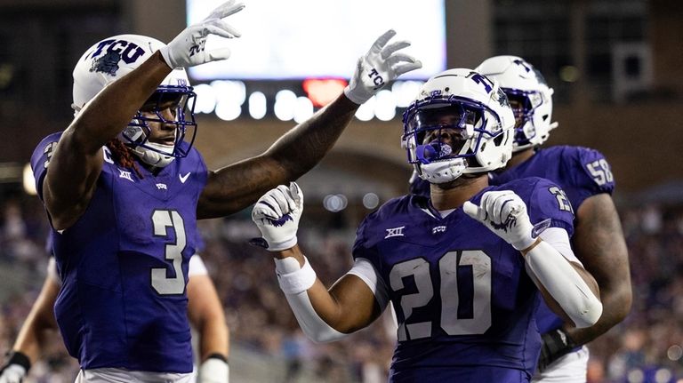 TCU running back Dominique Robinson (20) celebrates after scoring a...