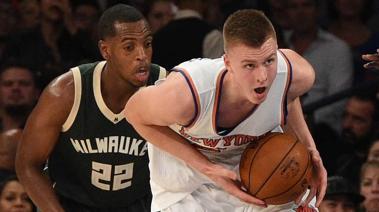 New York Knicks forward Kristaps Porzingis looks to pass in...