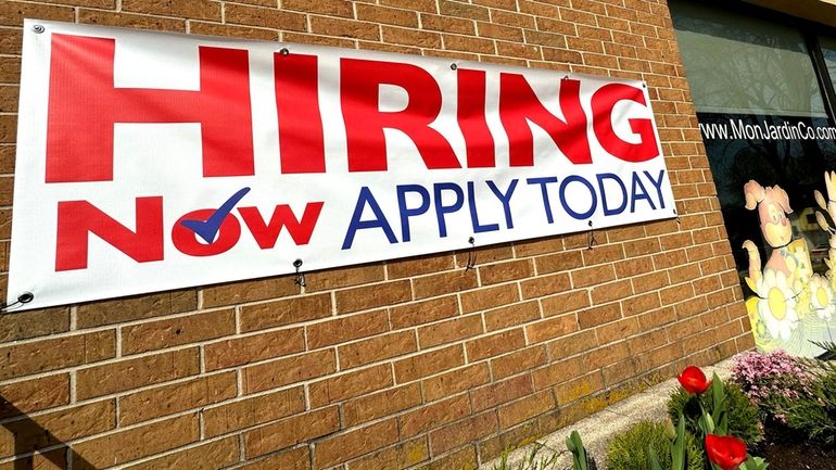 A hiring sign in Riverwoods, Illinois, on April 16. For the...