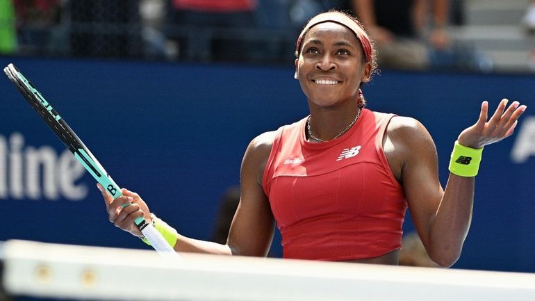 Coco Gauff reacts to the crowd after winning her quarterfinal...