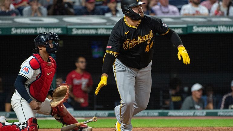 Pittsburgh Pirates' Rowdy Tellez, right, watches his RBI single off...