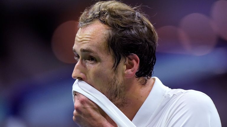 Daniil Medvedev, of Russia, wipes his face during his match...