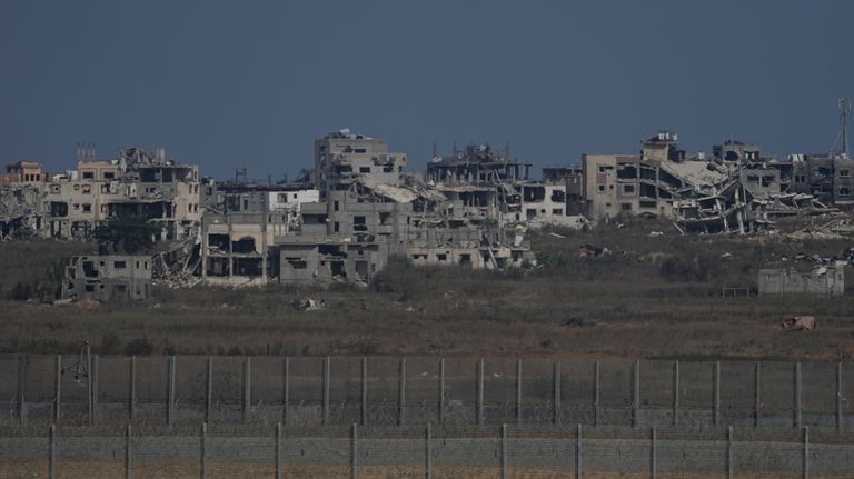 Destroyed buildings stand in the Gaza Strip, seen from southern...