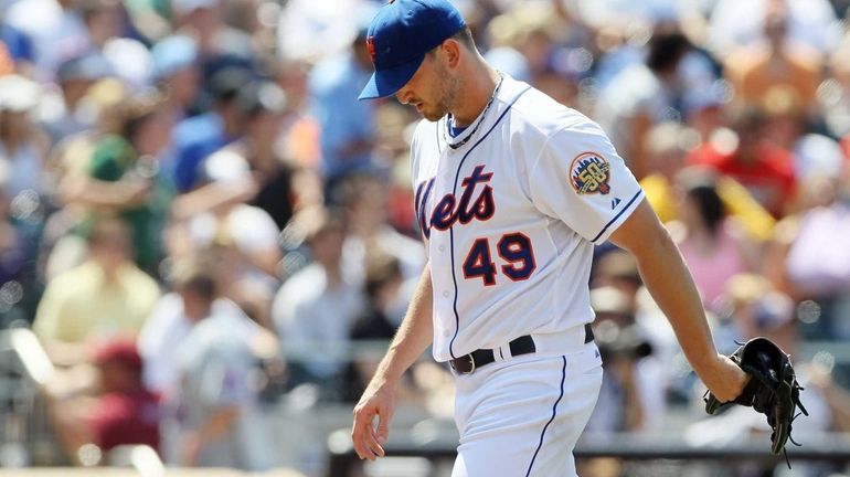 Jonathon Niese walks to the dugout after the seventh inning...