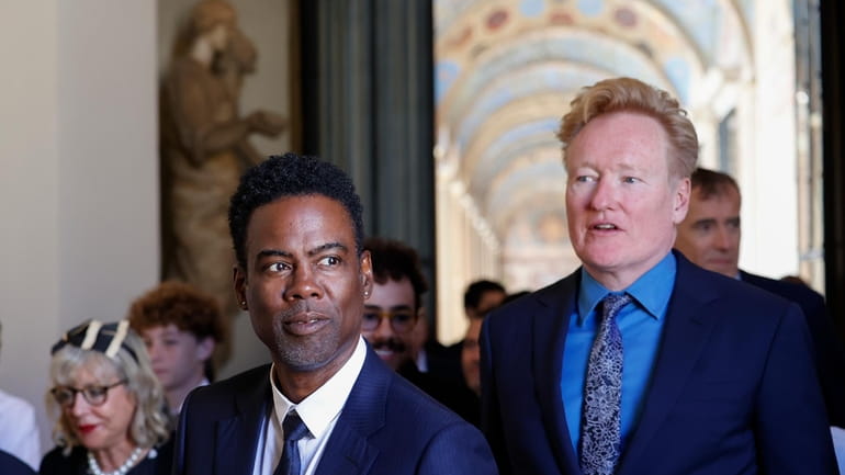Chris Rock, left, and Conan O'Brien arrive for an audience...