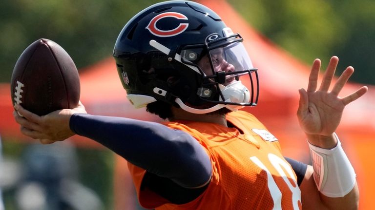 Chicago Bears quarterback Caleb Williams throws during an NFL football...