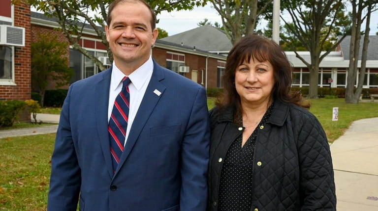 Suffolk District Attorney candidate Raymond Tierney and his wife, Erica, vote in Holtsville...