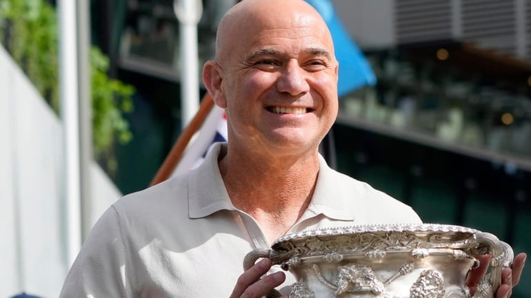 Former Grand Slam champion Andre Agassi poses with the men's...