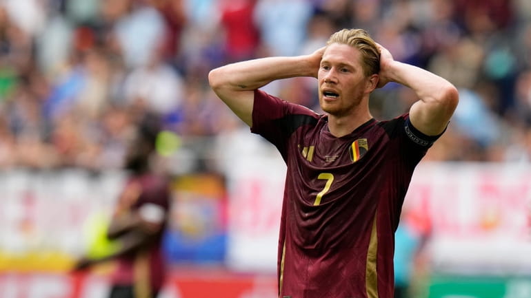 Belgium's Kevin De Bruyne gestures after missing a chance during...