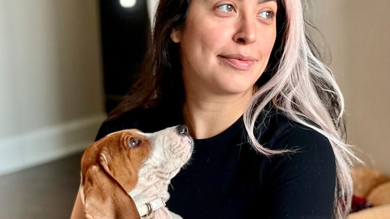 Kristie Pereira and her dog Beau pose for a photo...
