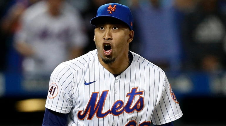 Edwin Diaz of the Mets reacts after the final out against...