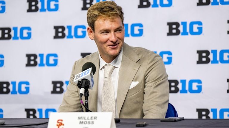 Southern California's Miller Moss talks with reporters during an NCAA...