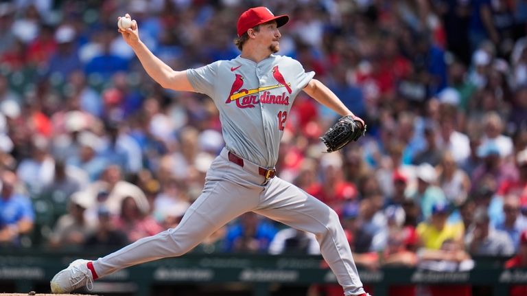 St. Louis Cardinals starting pitcher Erick Fedde throws against the...