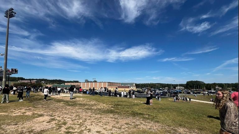 Students are evacuated to the football stadium after the school...