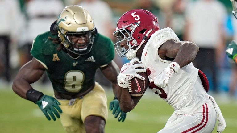 Alabama running back Roydell Williams (5) gets past South Florida...