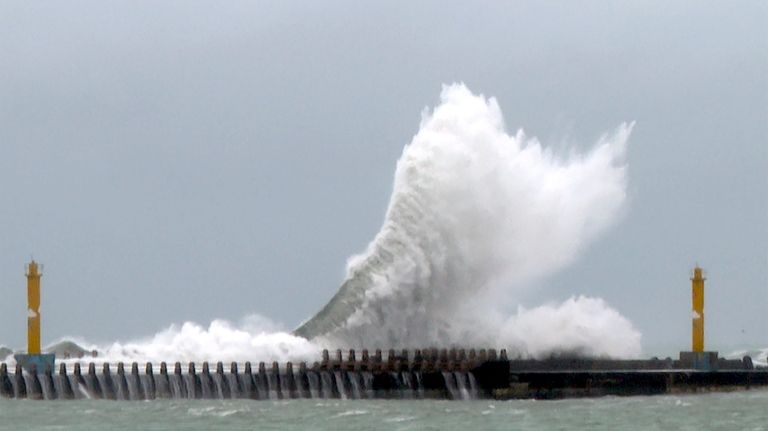 Waves crash onto the coastline before typhoon Gaemi makes landfall...