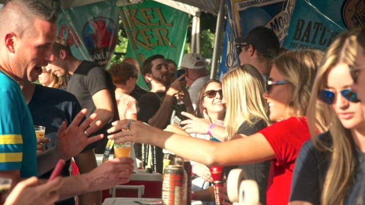 A crowd gathers at the third-annual Beer Fields craft beer...