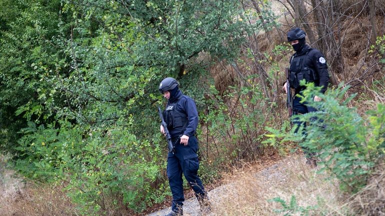 Kosovo police officers patrol an area near Banjska Monastery during...