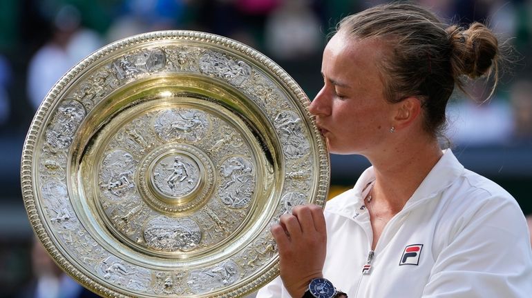 Barbora Krejcikova of the Czech Republic kisses her trophy after...