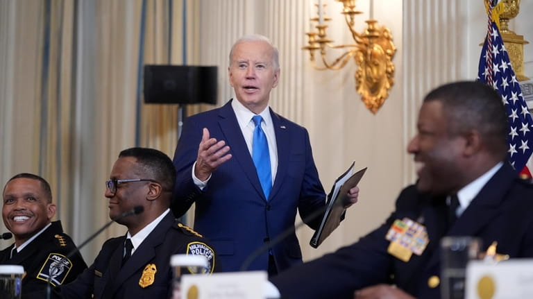 President Joe Biden speaks as he meets with law enforcement...