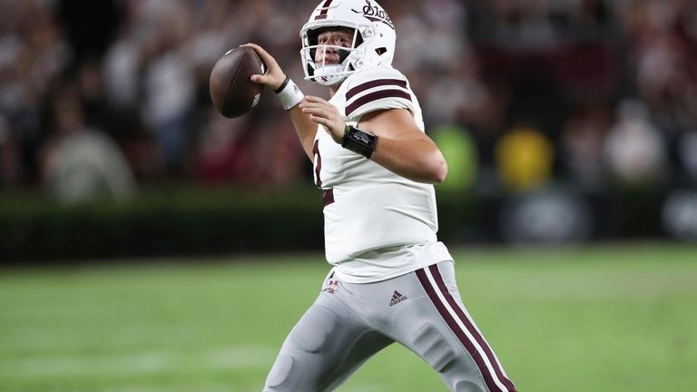 Mississippi State quarterback Will Rogers (2) rolls out to pass...