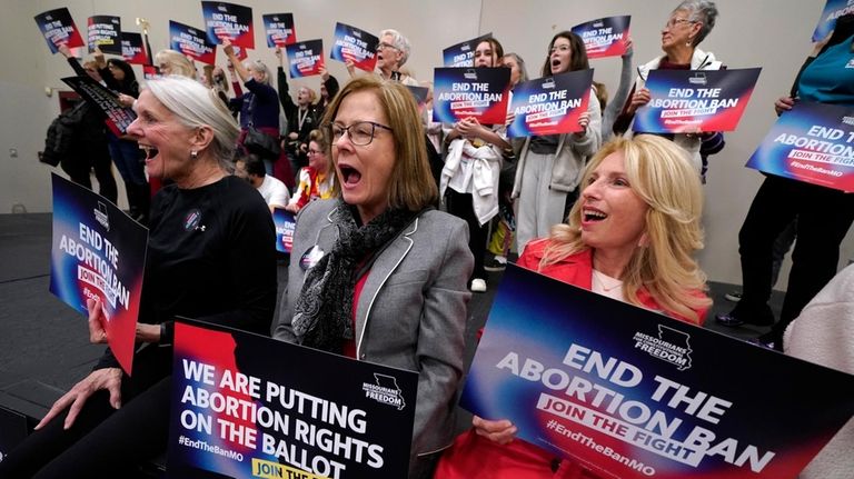 Missouri residents and abortion-rights advocation react to a speaker during...