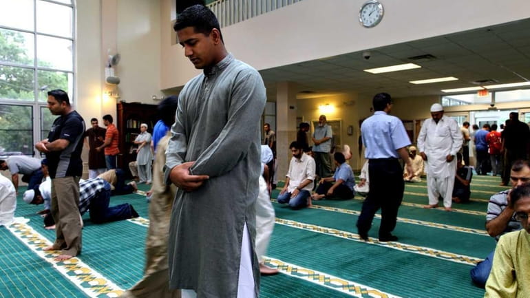 Ali Mushtaq, 19, of Brentwood, stands at the Masjid Darul...