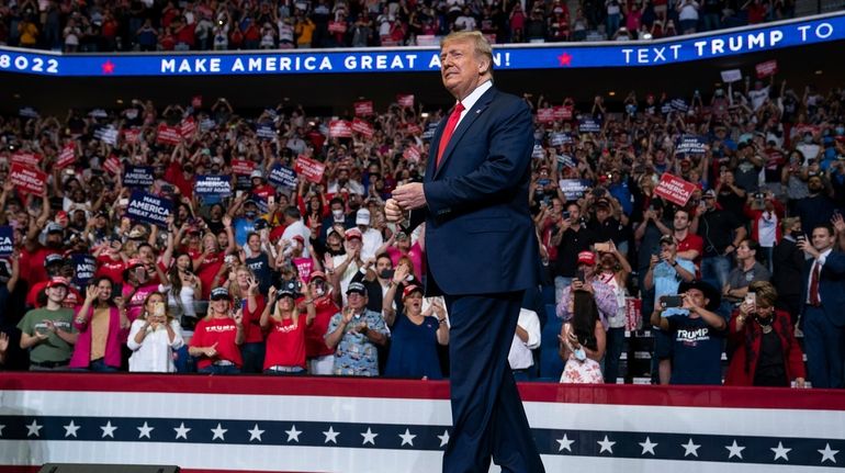 President Donald Trump arrives on stage to speak at a...