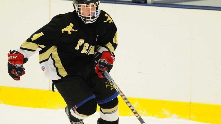 St. Anthony's High School #4 Tyler Hall carries through the...