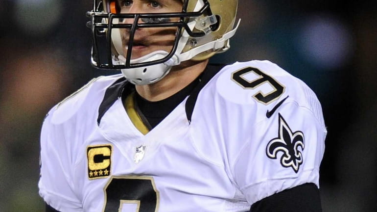 Drew Brees of the New Orleans Saints looks on against...