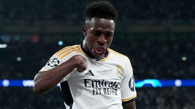 Real Madrid's Vinicius Junior celebrates after scoring his side's second...