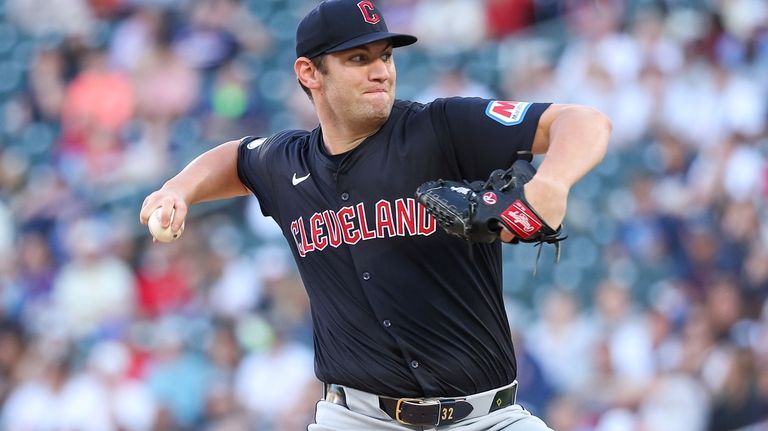 Cleveland Guardians starting pitcher Gavin Williams delivers against the Minnesota...