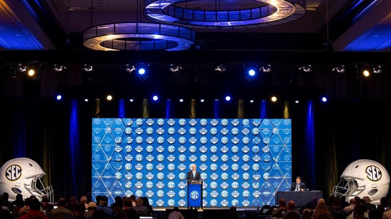 Southeastern Conference commissioner Greg Sankey gives an opening address during...