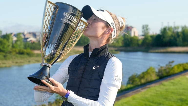 Nelly Korda poses for a picture after she won the...