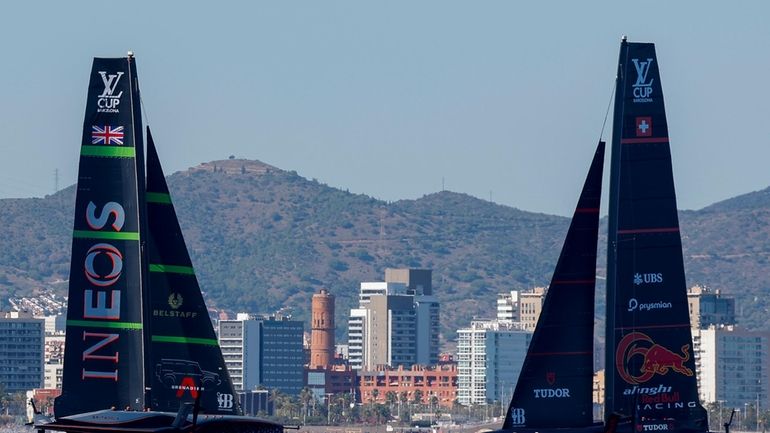 Ineos Britannia's AC75, left, and Alinghi Red Bull Racing's AC75...